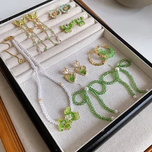 Green crystal butterfly heart flower earrings and pearl necklace set, elegant chic jewelry.