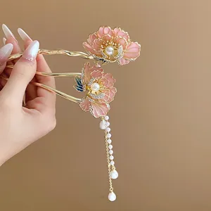 Exquisite detail of new Chinese style pink enamel flower hair stick with pearls and tassels.