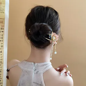 Close-up detail of Chinese style pearl flower tassel hair stick bun pin elegant antique hair accessory