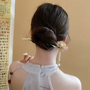 Chinese style metal hair stick with pearl tassel and flower detail for elegant hair buns.