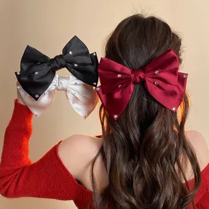 French satin bow hair clip with sparkling rhinestones, elegant hair accessory for women.