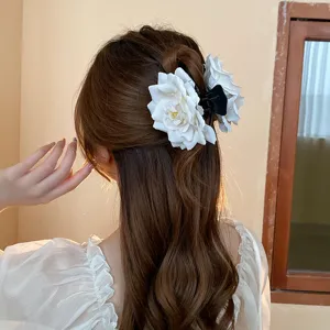 White flower hair claw clip for elegant hairstyles, beautiful back view detail showcase.