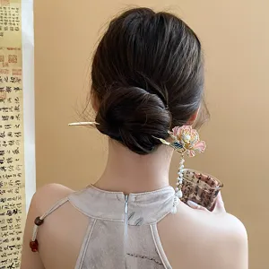 Exquisite Chinese style hair stick detail showing floral enamel design, pearls, and elegant tassel.
