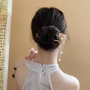 Exquisite Chinese style hair stick detail featuring elegant enamel flower and pearl tassels.