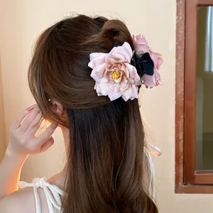 Pink rose flower hair claw clip detail, elegant floral hair accessory for women styling.