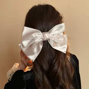 Chic satin bow hair clip with sparkling rhinestones elegant French spring barrette detail view