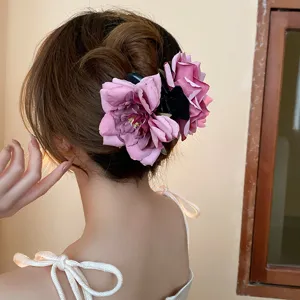Detail view of the sweet pink rose hair claw clip, showing exquisite fabric flower details.