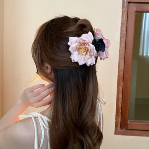 Sweet pink rose hair claw clip for women, elegant floral shark hairpin for chic daily styling and buns.