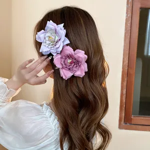 Detailed view of sweet dried rose flower hair clips, side duckbill clip for women and girls.