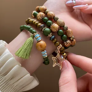 Bohemian multi-layer wooden beaded bracelet featuring green stone and cute star pendant charm.