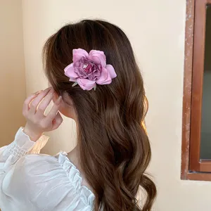 Chic dried rose flower hair clip for women, sweet fabric duckbill hairpin for styling.