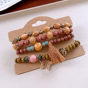 Bohemian multi-layer wooden bead bracelet set with tassel and star charm for women.