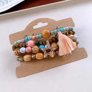 Bohemian multi-layer wooden bead bracelet detail, tassel and star charm accessory.
