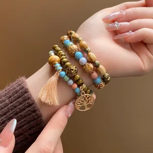 Bohemian multi-layer wooden beaded bracelet with tassel and tree pendant charm for women detail view