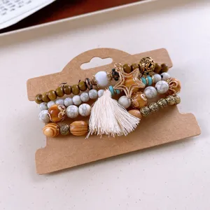 Bohemian multi-layer wooden bead bracelet set with star charm and tassel decor.
