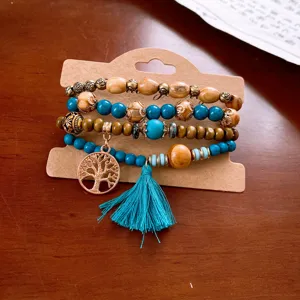 Bohemian multi-layer wooden bead bracelet set featuring turquoise stones and elegant tassel.