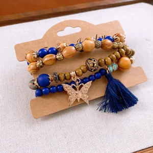 Bohemian multi-layer wooden bead bracelet set featuring blue beads, butterfly pendant and tassel.