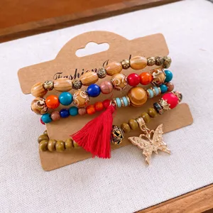 Bohemian multi-layer wooden beaded bracelet set with colorful stones, tassel and butterfly charm.
