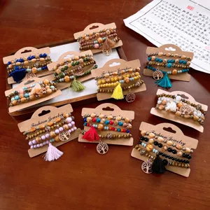 Bohemian multi-layer wooden bead bracelet set with tassel and tree pendant for daily wear.