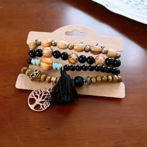 Bohemian multi-layer wooden bead bracelet set with tassel and tree pendant for women fashion.