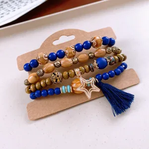 Bohemian multi-layer wooden bead bracelet detail, featuring blue beads and star charm.
