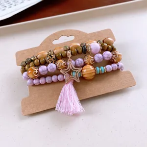 Bohemian multi-layer wooden bead bracelet featuring crackle stone, star charm and tassel.