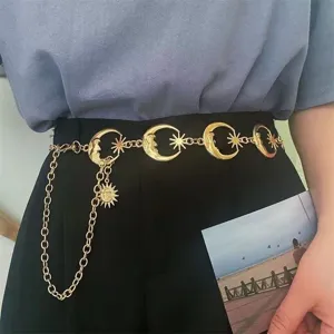 Gold metal moon and sun waist chain closeup, fashion body jewelry accessory for women.