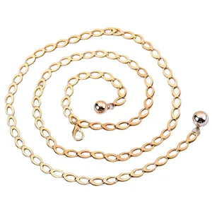 Detailed view of the gold metal geometric chain waist chain, featuring elegant hanging ball pendants.