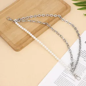 Detailed view of the multi-layer punk pearl and metal chain pants waist accessory.