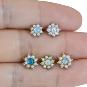 Stainless steel floral dermal anchor piercing jewelry with opal and pearl cluster design.