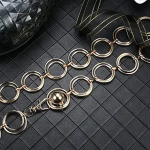 Close-up detail of double-layer metal ring waist chain, elegant gold-toned geometric links.