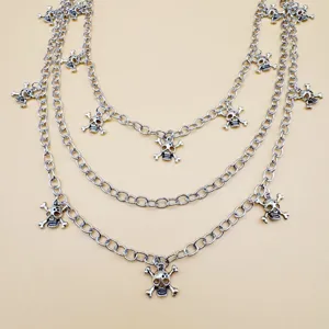 Detailed view of the punk style multi-layer metal skull pendant waist chain street style.