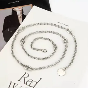 Chic silver metal chain belt with classic pig nose links and round pendant for women fashion.