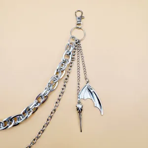 Punk mehrschichtige Metall Hosenkette mit Vogelschädel und Flügelanhänger für Damen Mode.