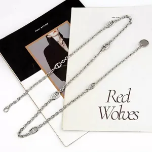 Silver metal waist chain featuring distinctive pig nose links, trendy body chain jewelry for women.