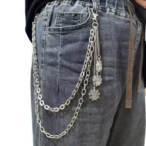 Close-up of a punk style multi-layer metal pants chain with silver spider web pendants for edgy outfits.