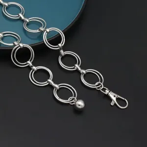 Detailed close-up of the retro silver double ring waist chain featuring a secure lobster clasp.