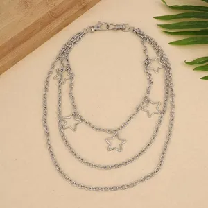 Punk style multi-layer metal waist chain featuring hollow star charms, detailed view.