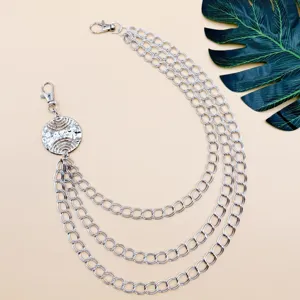 Punk style multi-layer metal waist chain with round pendant, detailed shot for street wear.
