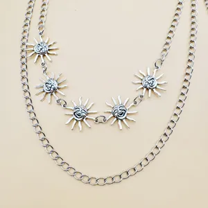 Multi-layer silver metal waist chain with vintage sun face pendants for punk hip hop style.