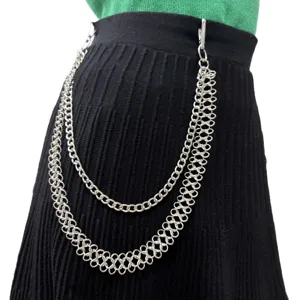 Close-up detail of the punk style silver layered metal pants chain accessory showing links.
