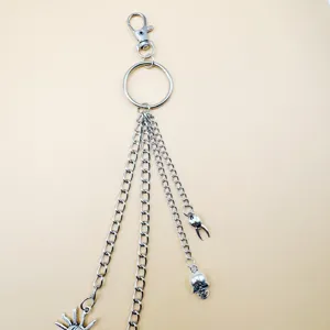 Detailed closeup of a trendy punk style multi-layer metal skull claw hip hop pants chain.