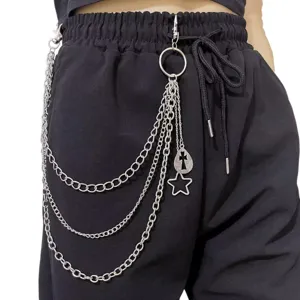 Detail shot of punk multi-layer metal pants chain with cross and star charms for hip hop style.