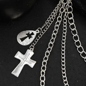 Detail shot of punk silver metal waist chain with cross pendants, hip hop multi-layer design.