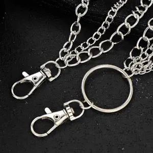 Multi-layer silver metal pants chain, punk hip-hop style trousers chain accessory detail.
