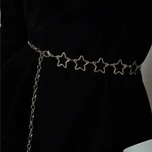 Gold metal star waist chain detail shot, punk style body chain for women party wear.