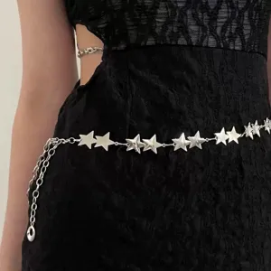 Close-up detail of a silver star metal waist chain accessory, sparkling body chain.
