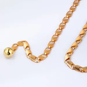 Gold metal chain belt with a smooth ball pendant, punk style body chain for women.