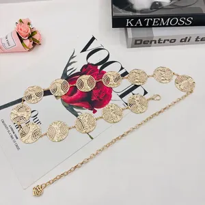 Gold metallic coin circle waist chain detail, fashion hollow out body chain jewelry accessory.