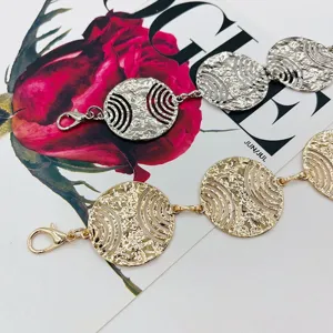 Detailed shot of trendy women round hollow metal waist chain, ethnic style body chain.